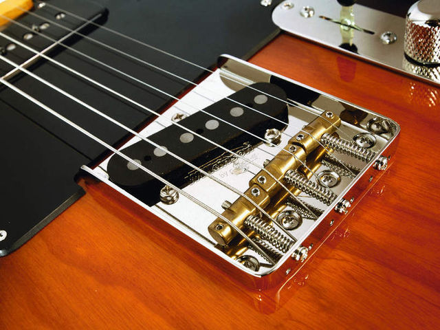 Note the Wilkinson bridge with brass saddles